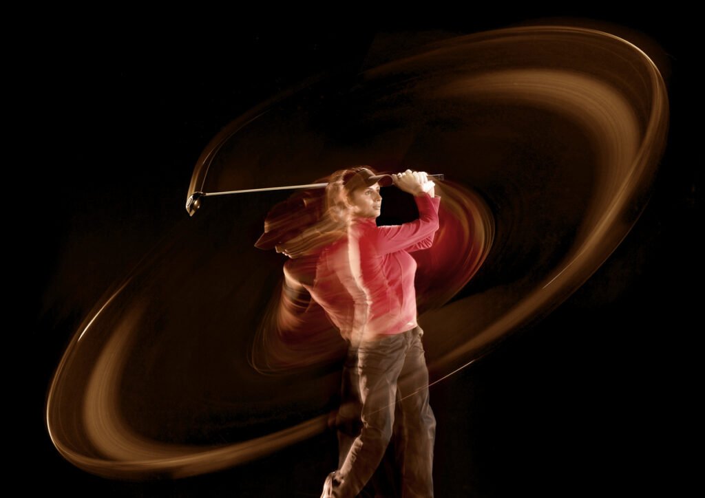 Athlete sprinting outdoors during a sports performance session at Nudge Sports